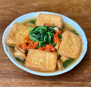 Poached Amaranth Leaf with Beancurd & Whole Garlic in Superior Broth
