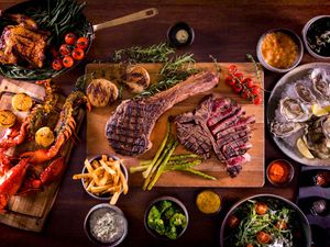 Whiskey-aged Tomahawk + 2 Sides + 1 Bottle of Wine
